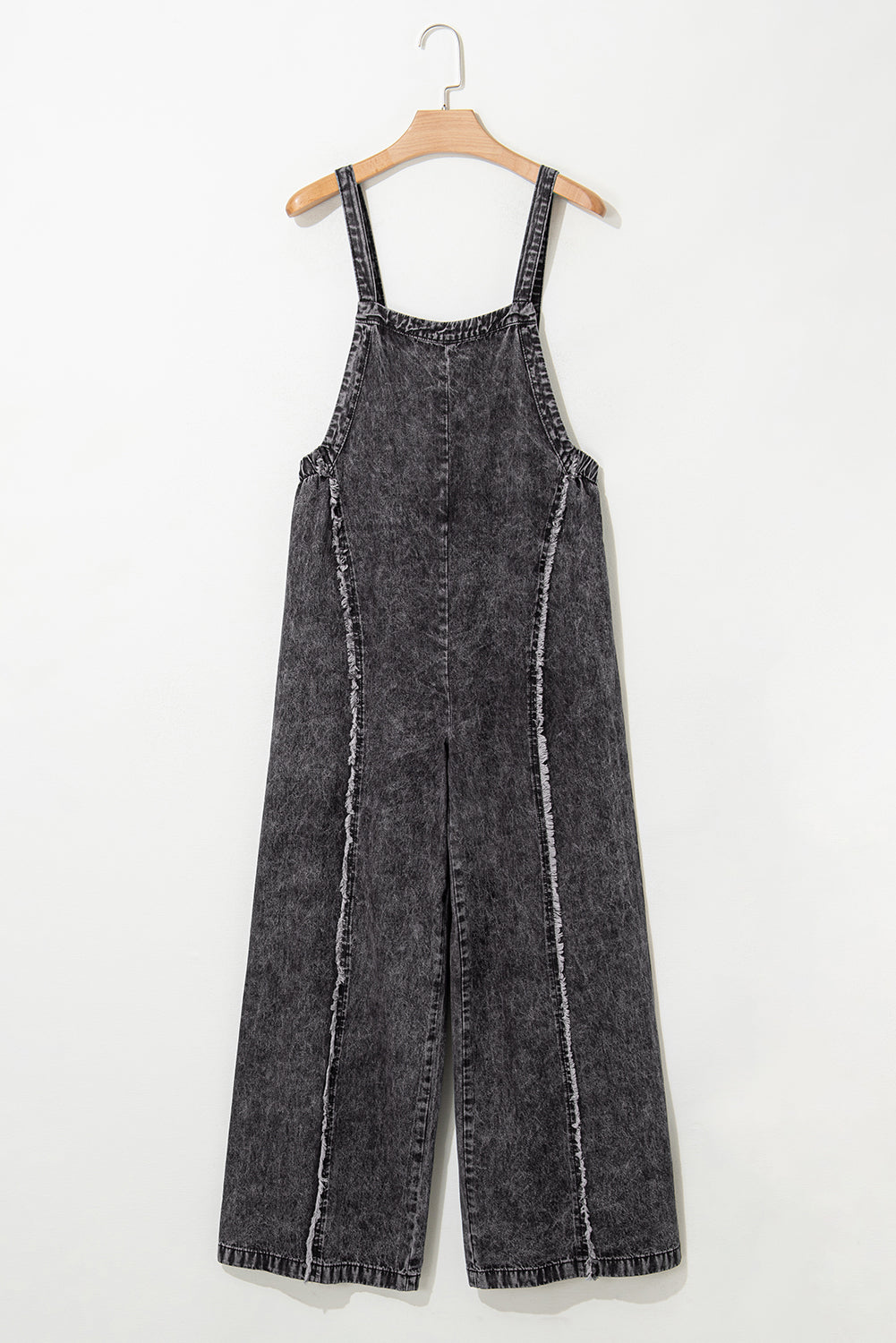 Salopette en jean bleu clair délavé à jambes larges et coutures apparentes