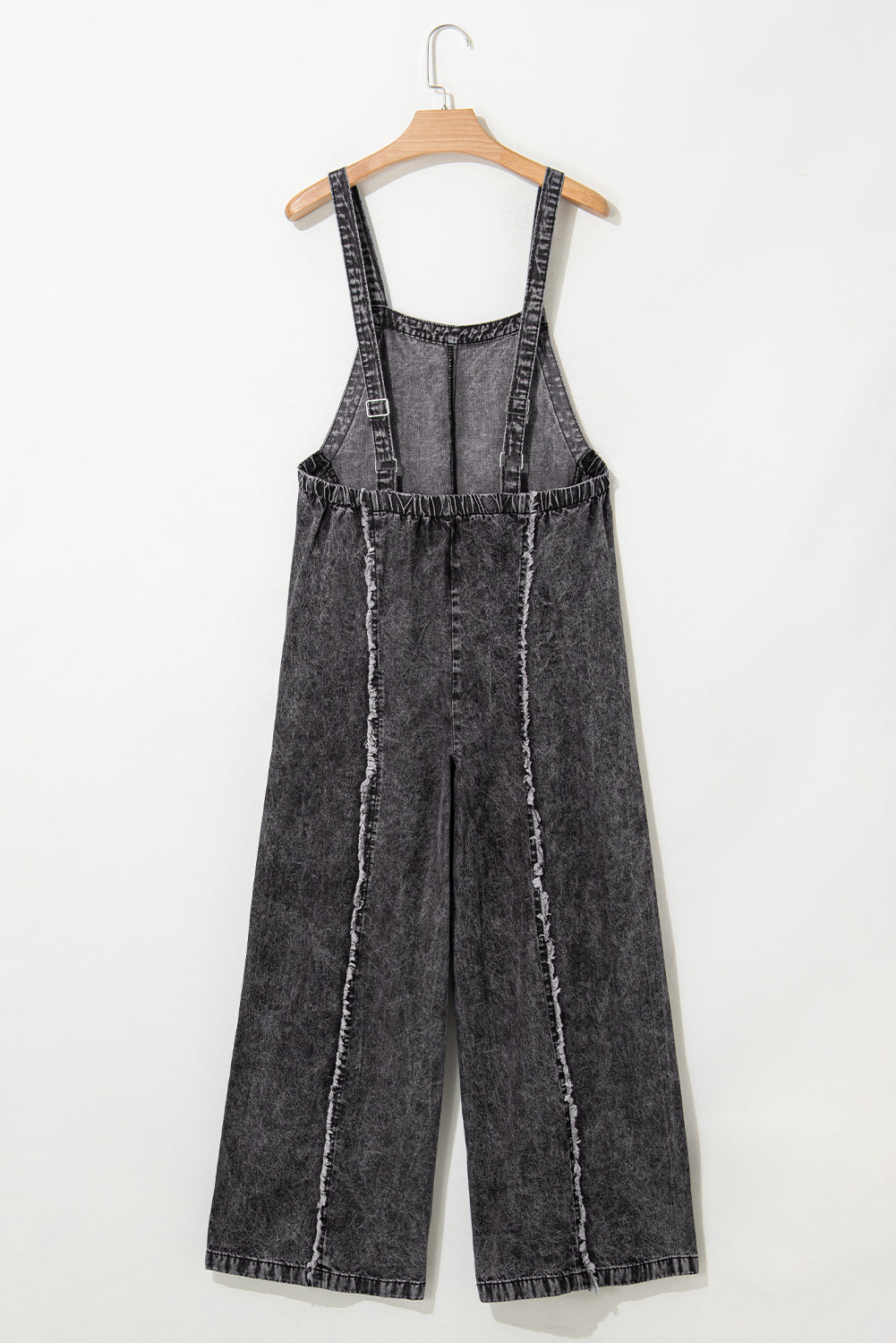 Salopette en jean bleu clair délavé à jambes larges et coutures apparentes